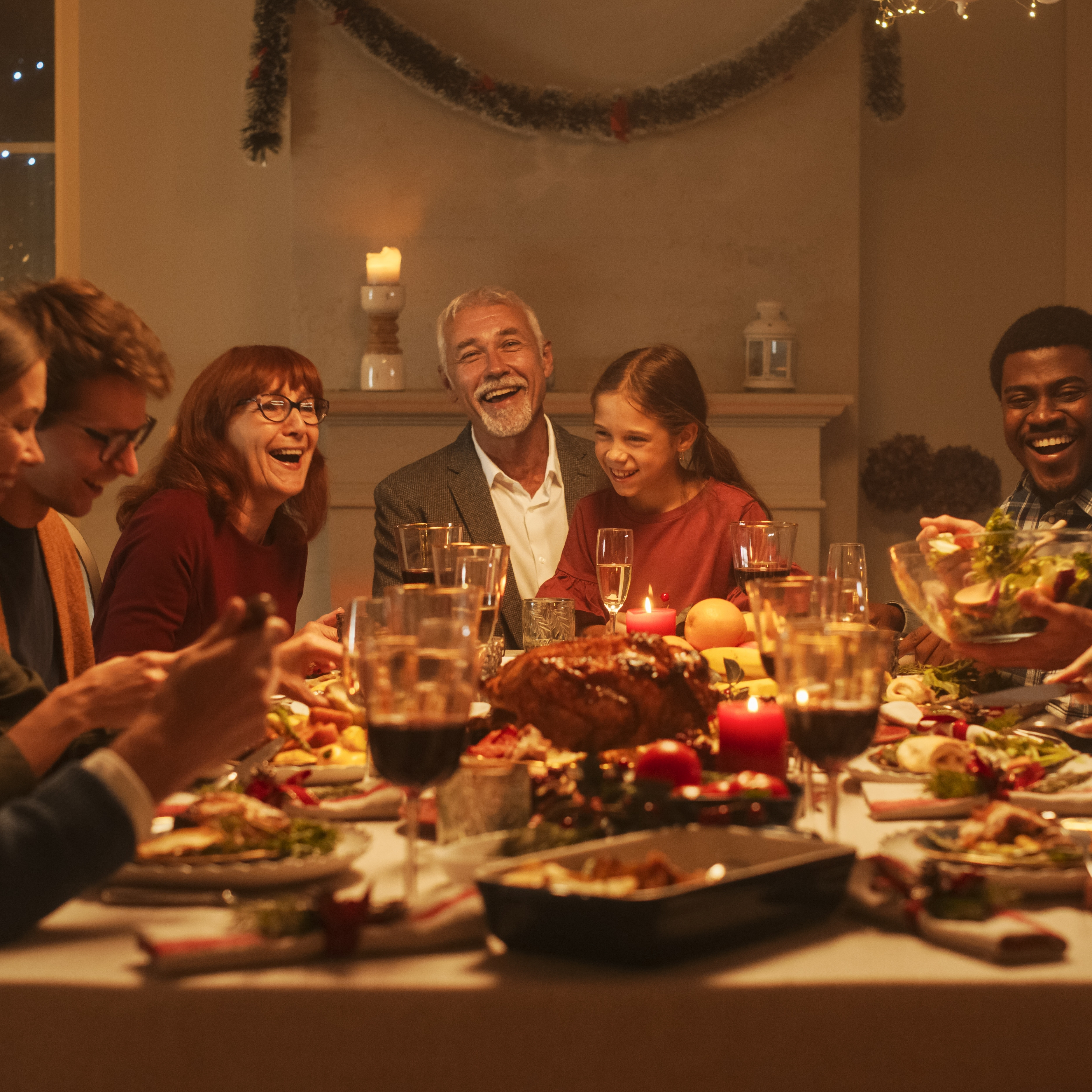 Multigenerational family enjoying holiday dinner.